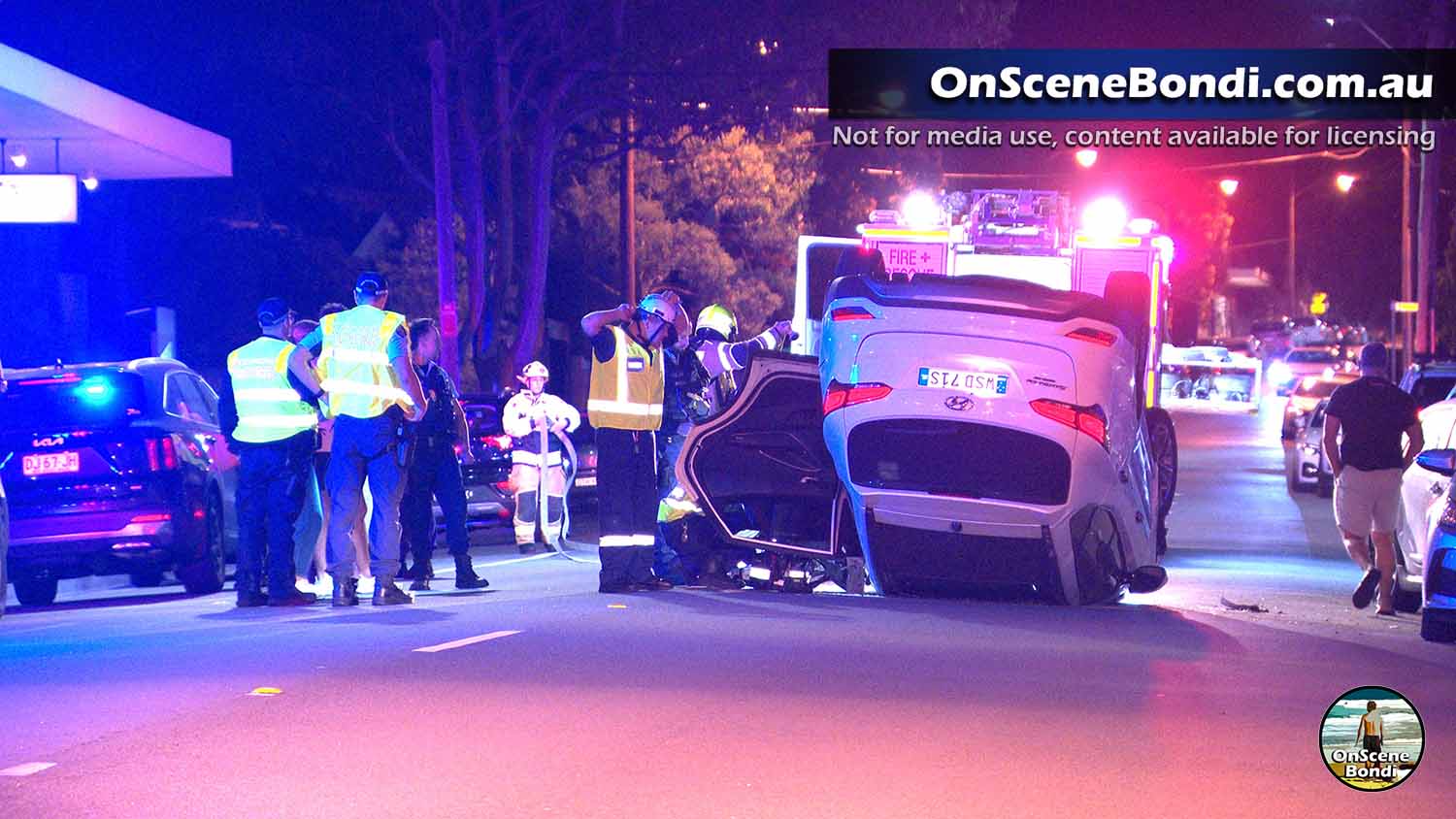 Man rescued after car rolled in Rose Bay